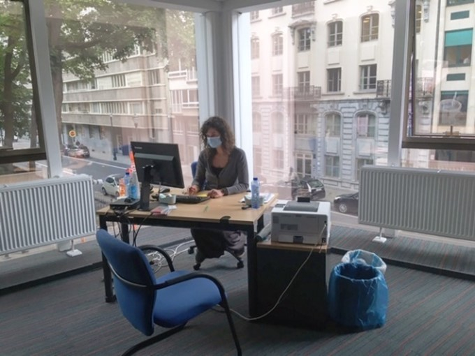 Valentine, the coordinator of the women's shelter and a map of the European Parliament's building